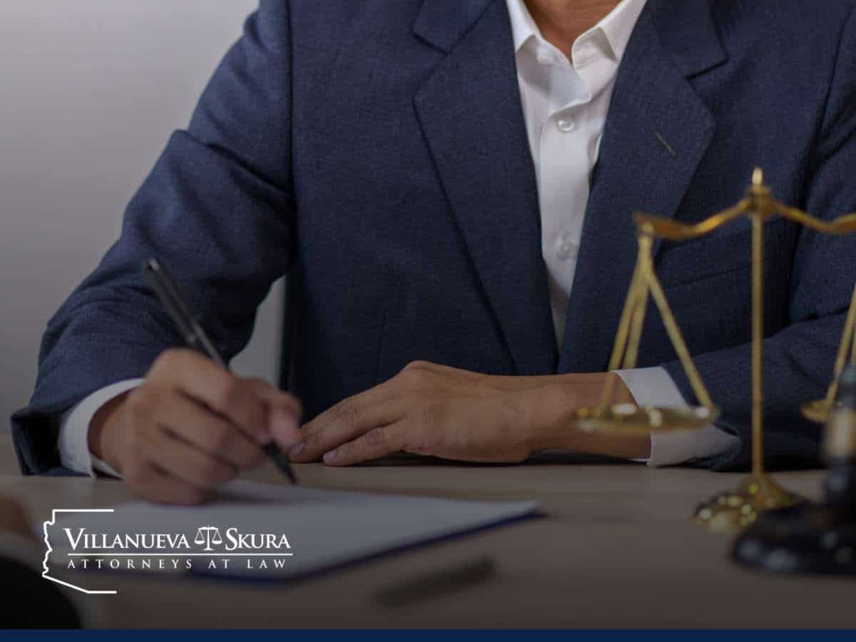 Attorney reviewing legal documents on sex crimes defense at Villanueva Skura Attorneys at Law