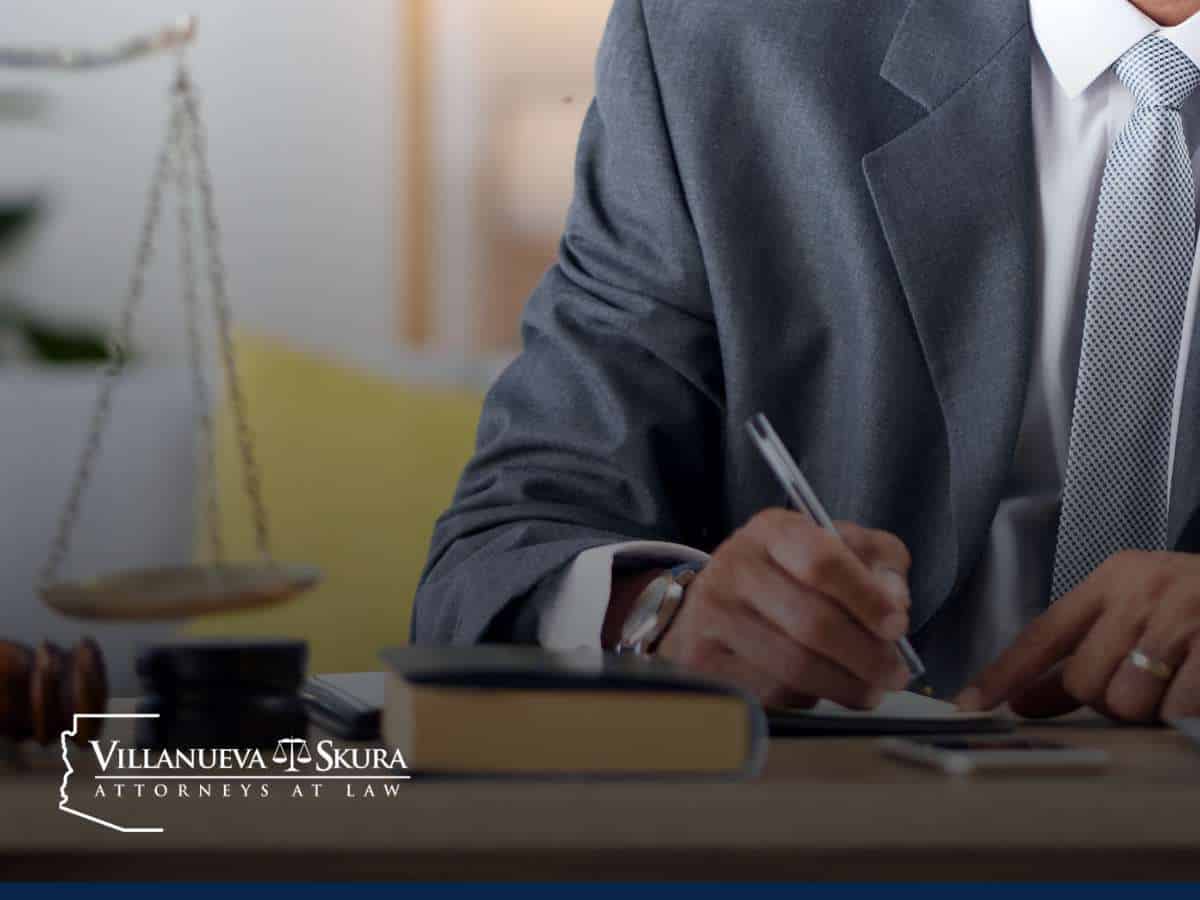 Attorney reviewing documents for Arizona sex crime cases with legal scale in the background