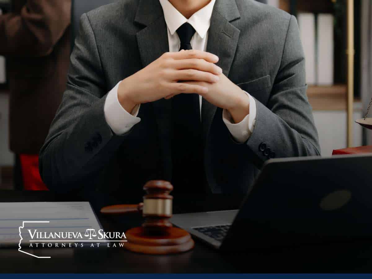 Attorney discussing legal strategies for sex crime cases in Arizona with gavel and laptop on desk